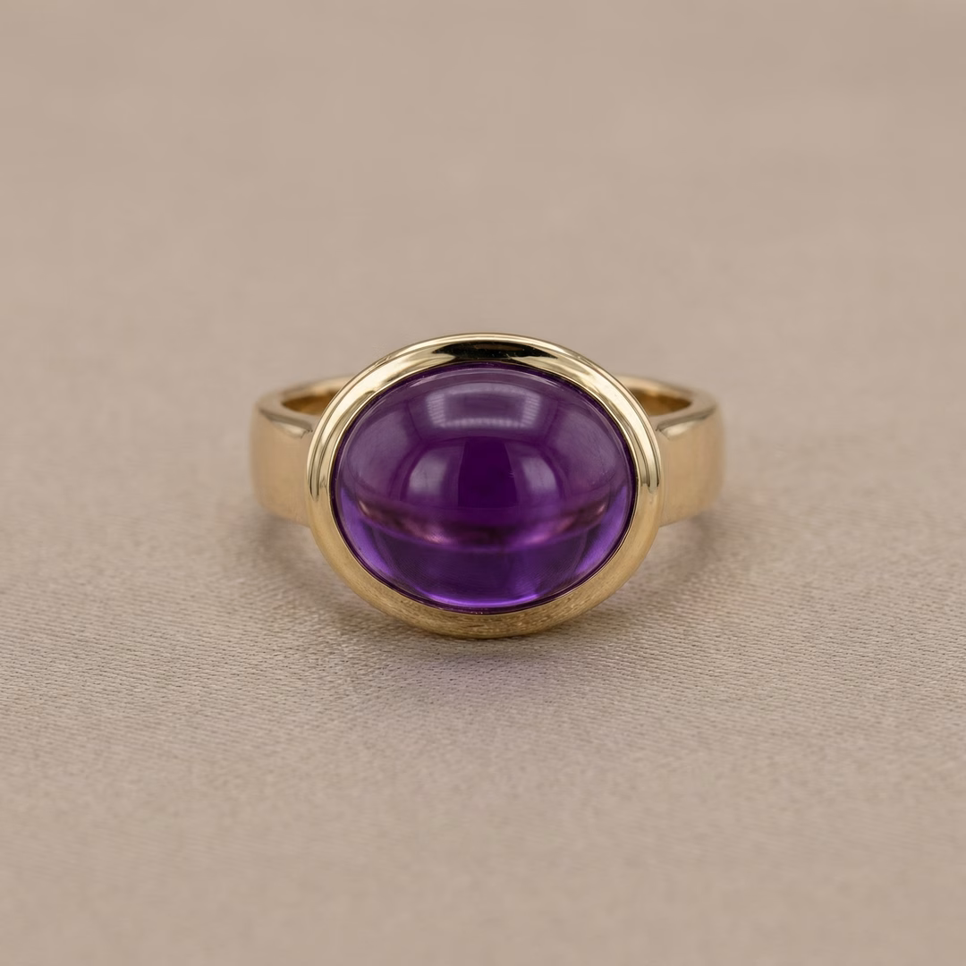 14k yellow gold ring with oval amethyst cabochon gemstone in bezel setting, fine purple gemstone jewelry