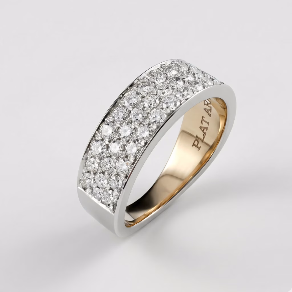 Custom platinum wide wedding band by Arato featuring three rows of pave-set brilliant diamonds with a polished interior shank.
